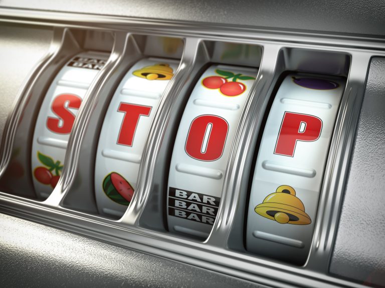 stop-gambling-addiction-concept-slot-machine-with-text-stop (1)